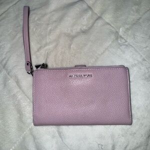 Michael Kors Wristlet in a purple/pink color